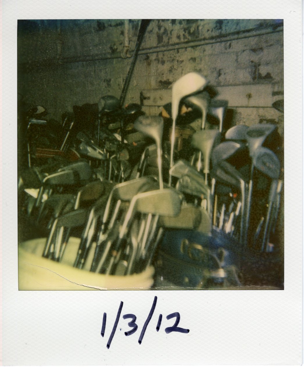 Piles of golf clubs in a Salvation Army