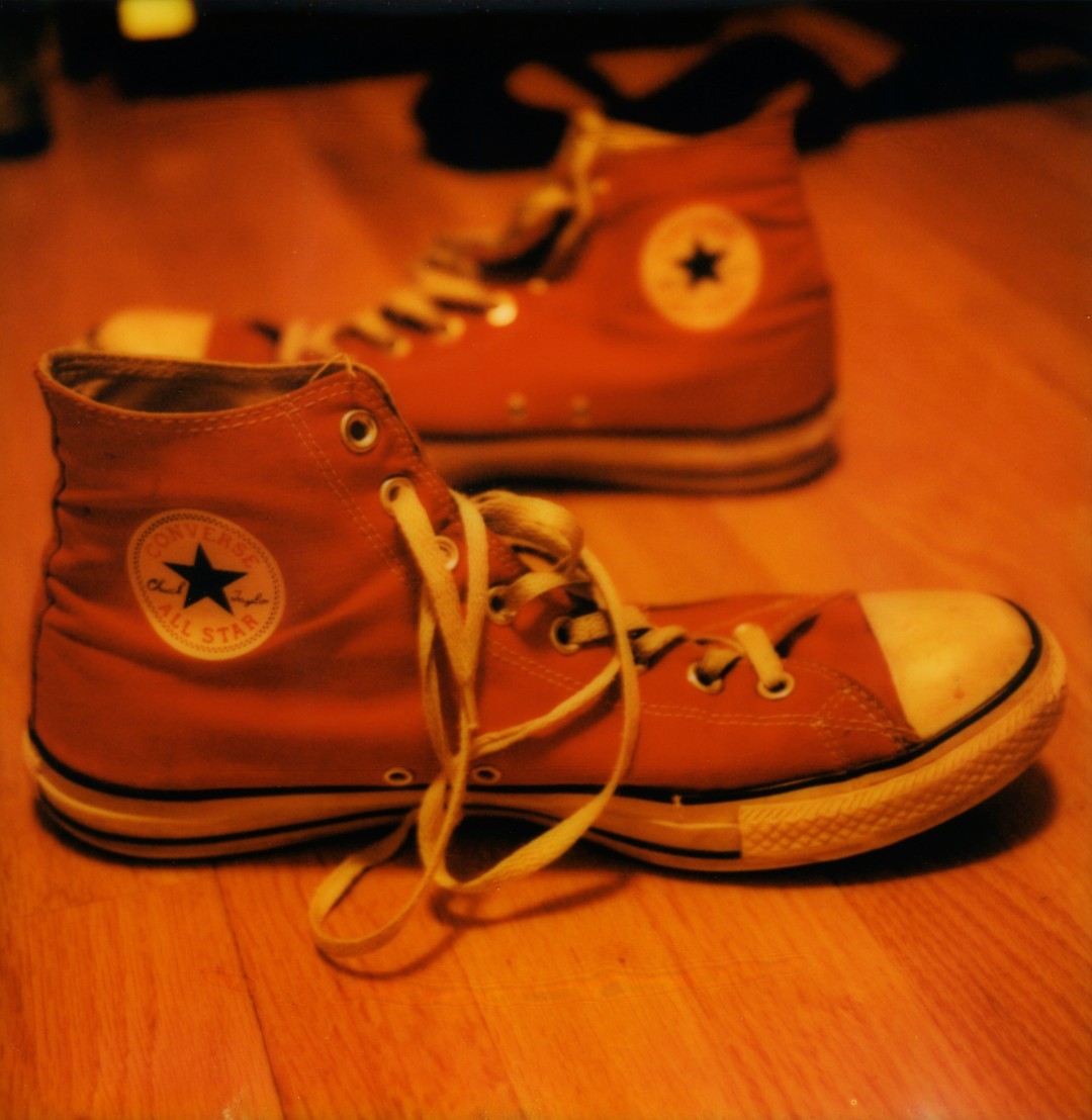 A pair of red Converse Chuck Taylor All-Star shoes