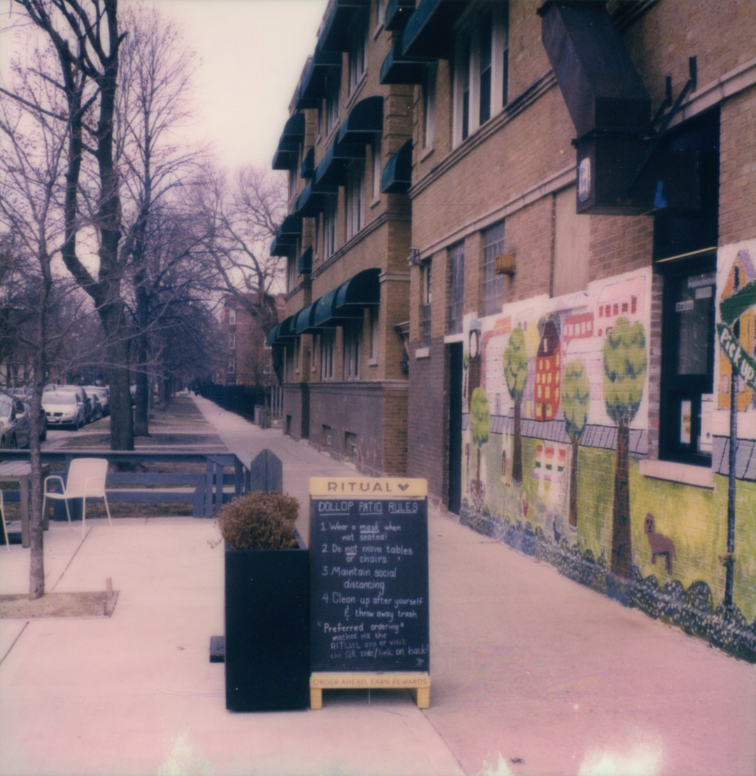 A sandwich board with chalk writing on it, it's too small to read in the photograph