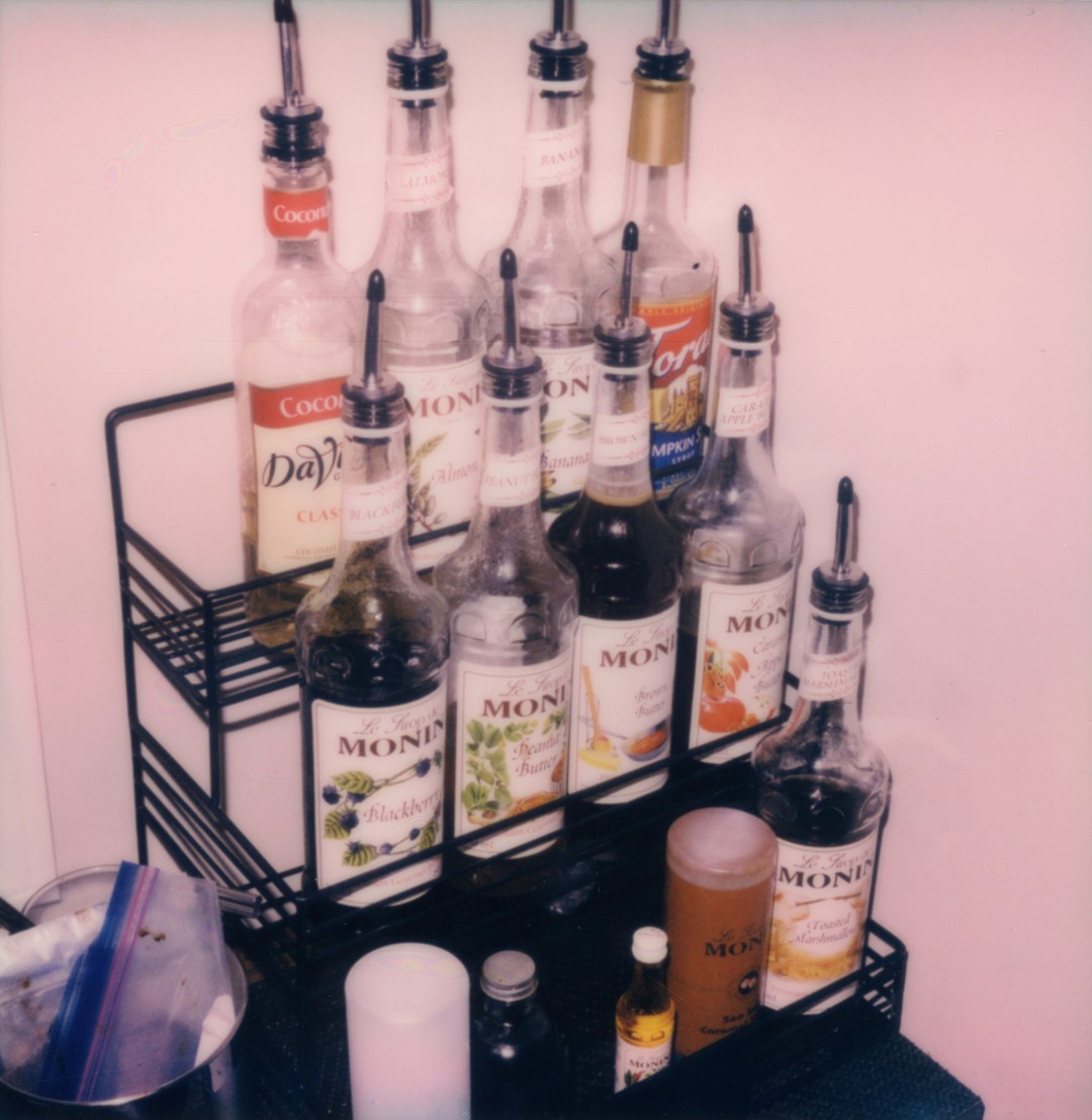 A rack of coffee syrups