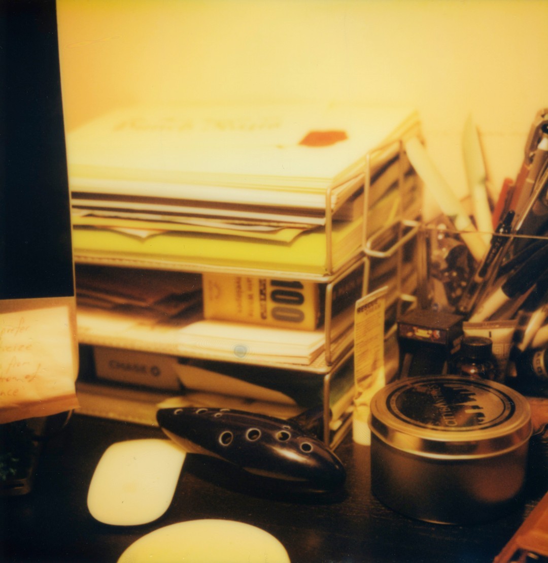 A desk organizer filled with neatly stacked papers