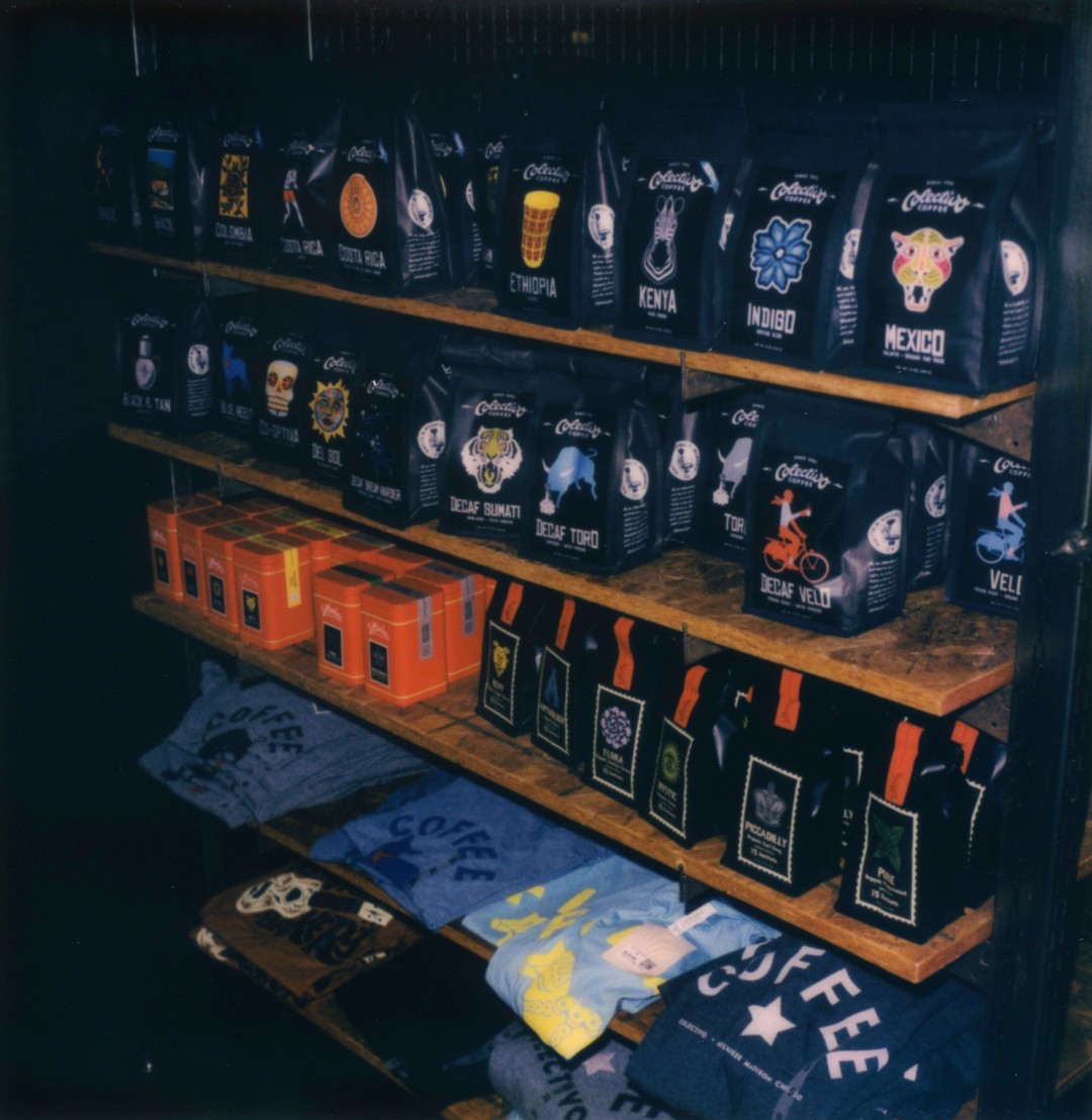 A shelf of bags filled with coffee beans