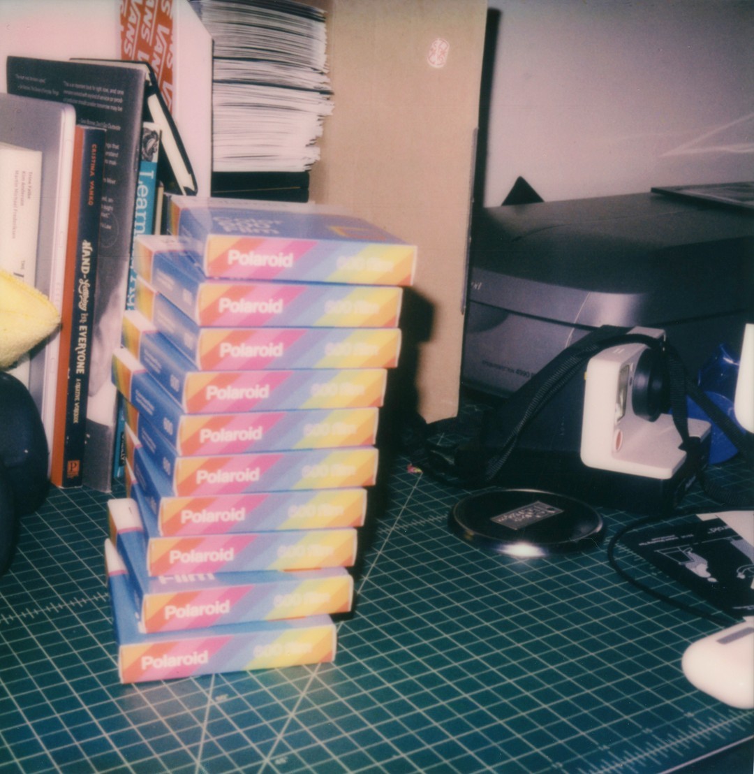 A stack of 10 Polaroid 600 film boxes.